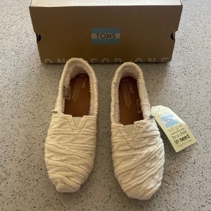 TOMS slip on cream flats